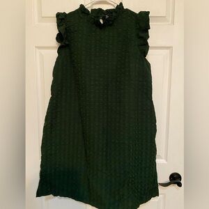 NWOT. Dark green dress with ruffled neck and shoulders.